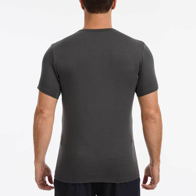 The back of person wearing a grey Ejis TotalShield sweat proof t-shirt on a white background