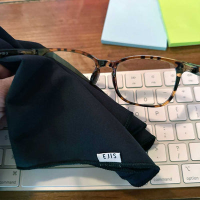 Ejis sweat absorbing handkerchief wiping glasses on desk