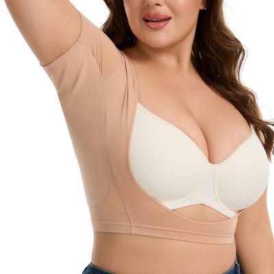 Woman wearing a cream bra under a nude-colored Ejis Sweat Proof Bustier