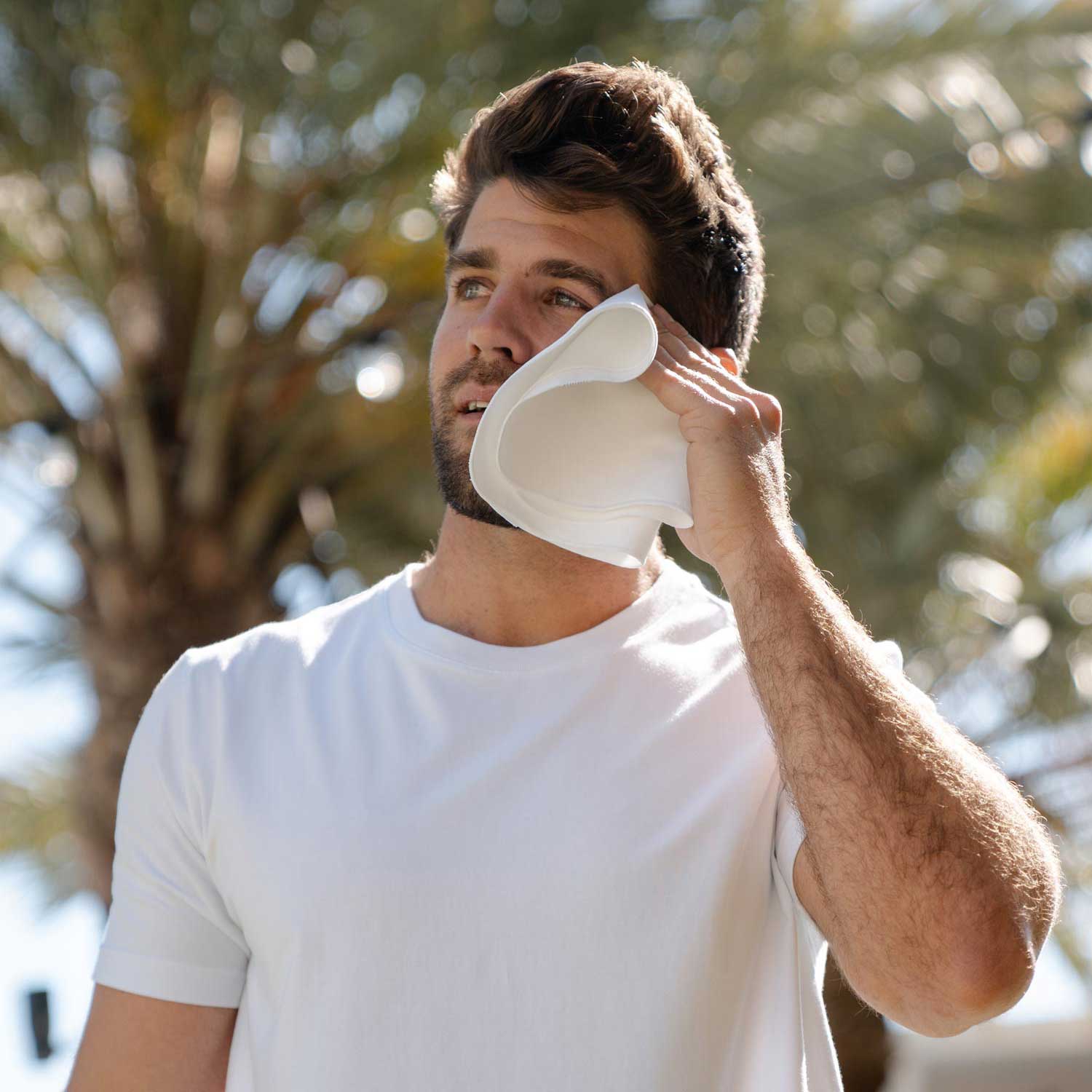 Ejis Sweat Absorbing Handkerchief wiping man's face