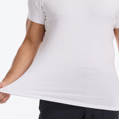 Person stretching a white Ejis TotalShield sweat proof t-shirt on a white background