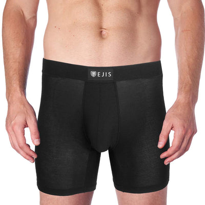 man wearing performance boxer briefs on white background
