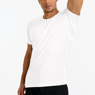 Man wearing a white TotalShield t-shirt with his arm raised over his head on a white background