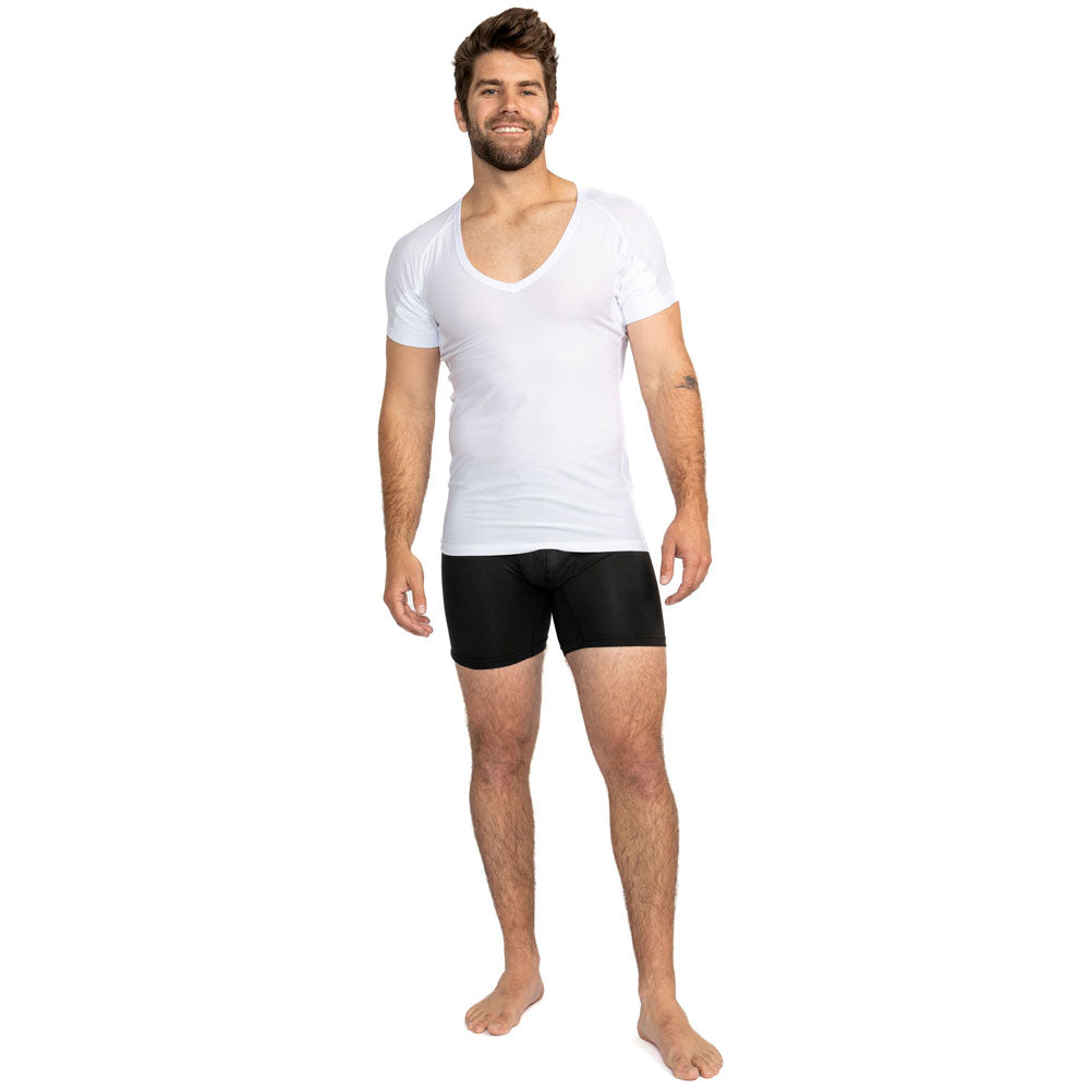 Man wearing a white Ejis deep V ultra breathable undershirt and Ejis black sweat proof boxer briefs on a white background