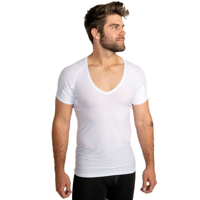 Man wearing a white Ejis deep V ultra breathable sweat-proof undershirt on a white background