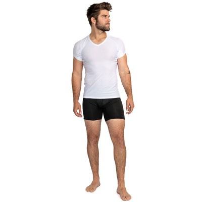 Man wearing white V-neck ultra breathable undershirt and black boxer briefs. Facing right on white background